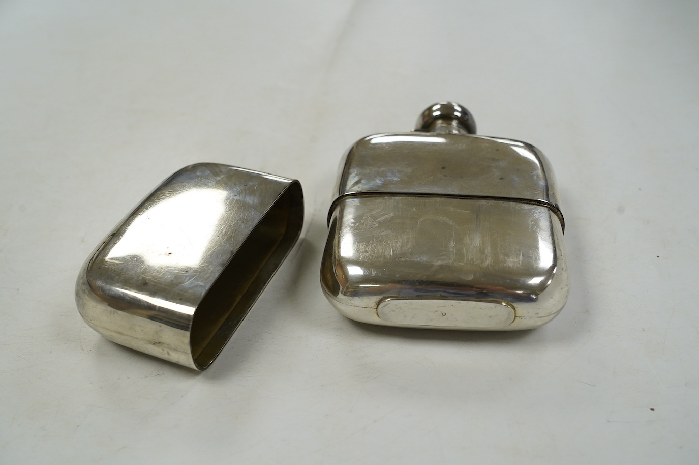 A George V silver hip flask, by Charles S. Green & Co, Birmingham, 1917, 14.5cm. Condition - poor